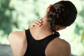 The girl was worried about the symptoms of cervical osteochondrosis